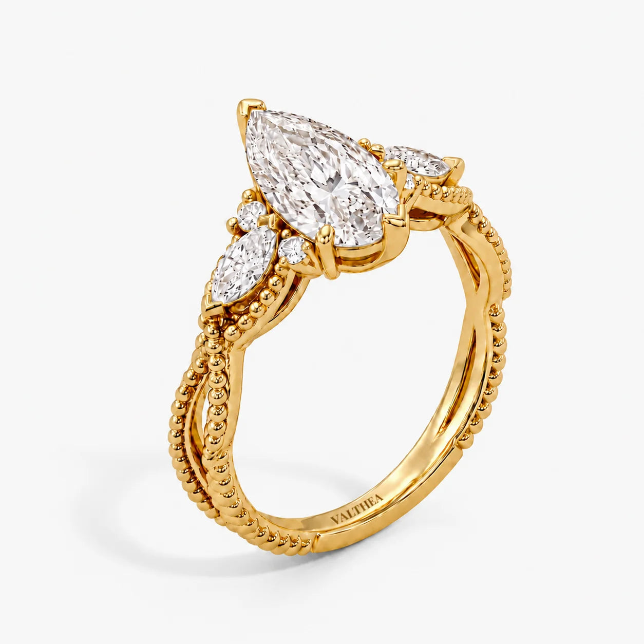 The Astra Bind Pear Solitaire Ring