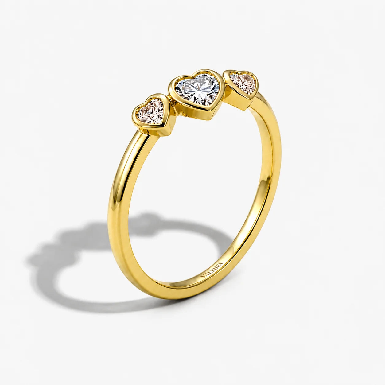 The Cor Fluctus Triple Heart Pave Ring