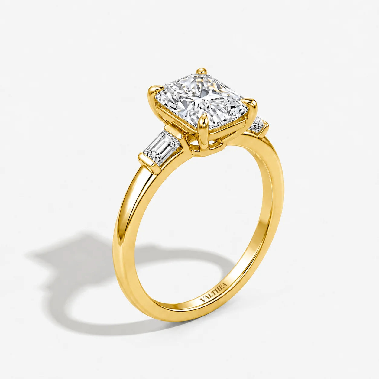 The Edge Emerald Cut Three-Stone Solitaire Ring
