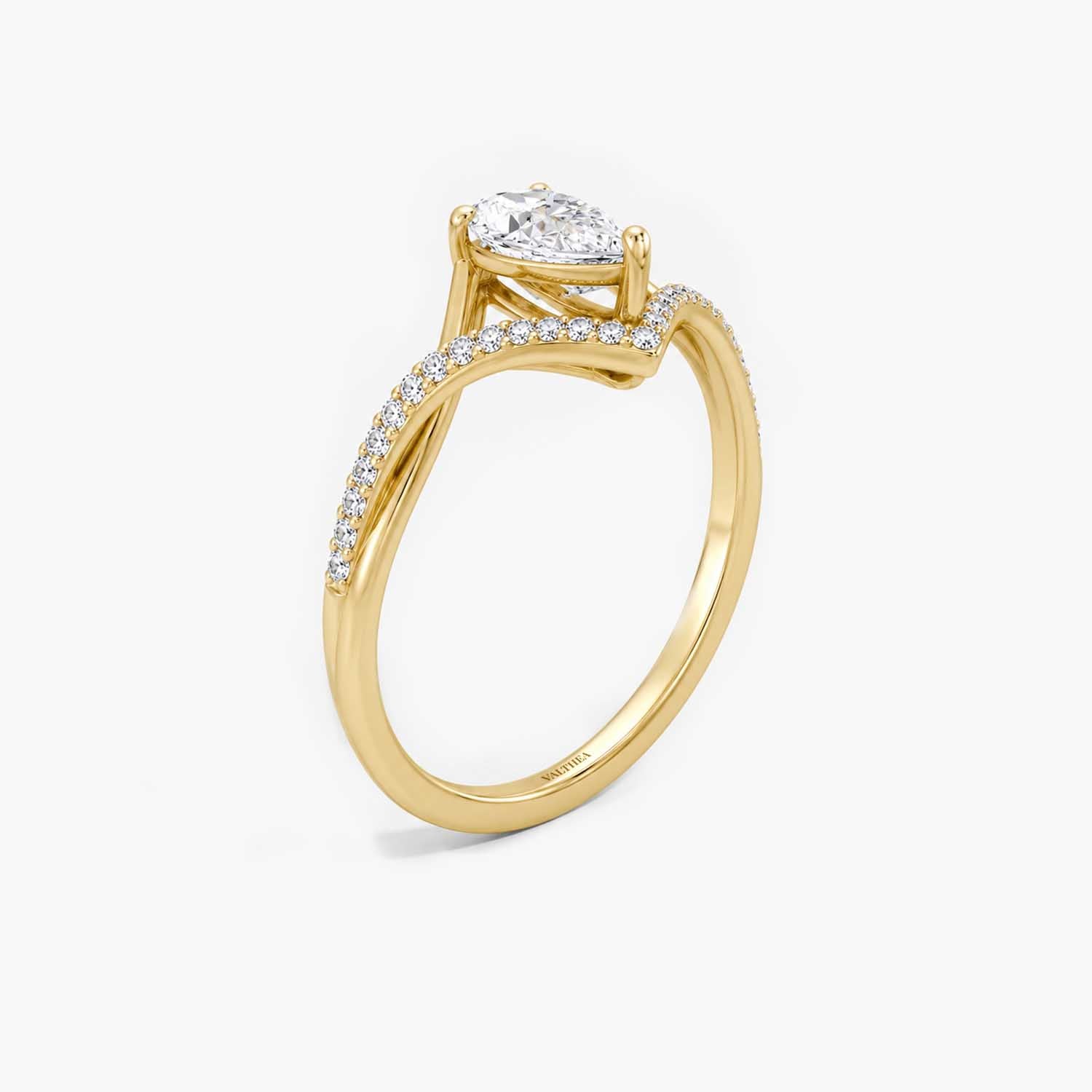 The Couronne Lumiere Pear Solitaire Ring